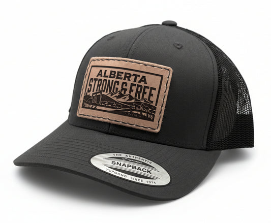 Black trucker cap with 'Alberta Strong & Free' patch on a light gray background