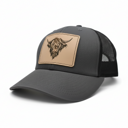 Gray cap with a tan patch featuring a logo on a white background
