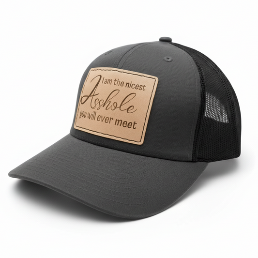 Gray trucker cap with a brown leather patch on a light gray background