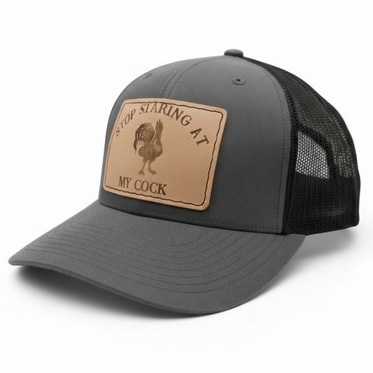 Gray and black cap with a leather patch on a white background