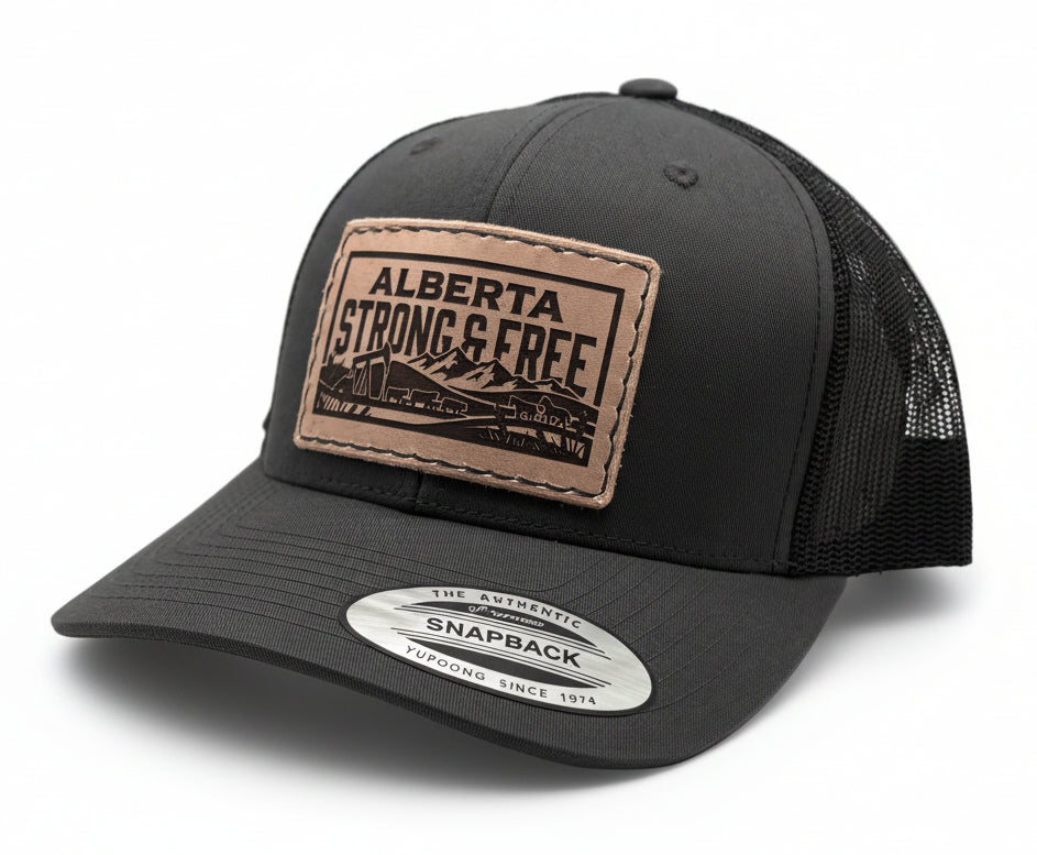 Black trucker cap with 'Alberta Strong & Free' patch on a light gray background