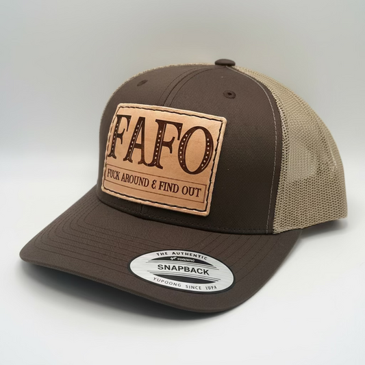 A brown leather hat with a patch on the front that reads 'FAFO' and the phrase 'Fuck Around & Find Out' on it.