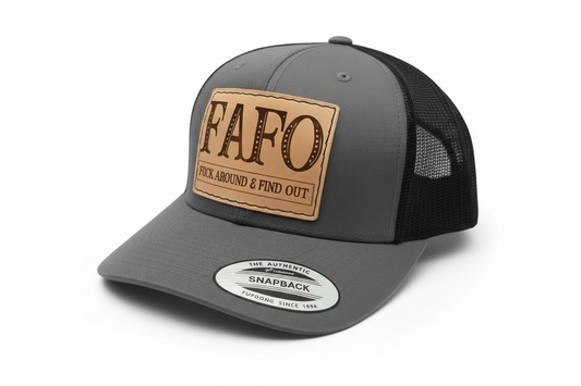 Black trucker cap with a brown leather patch and 'FAFO' branding on a white background