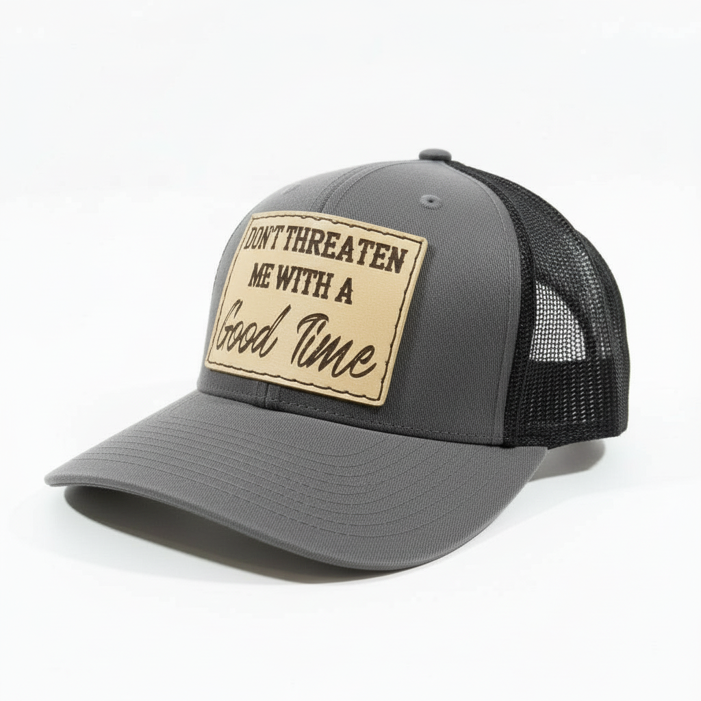 Brown and beige cap with a patch saying 'Don't threaten me with a good time' on a white background