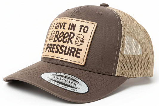 Brown and beige cap with a humorous patch on a white background