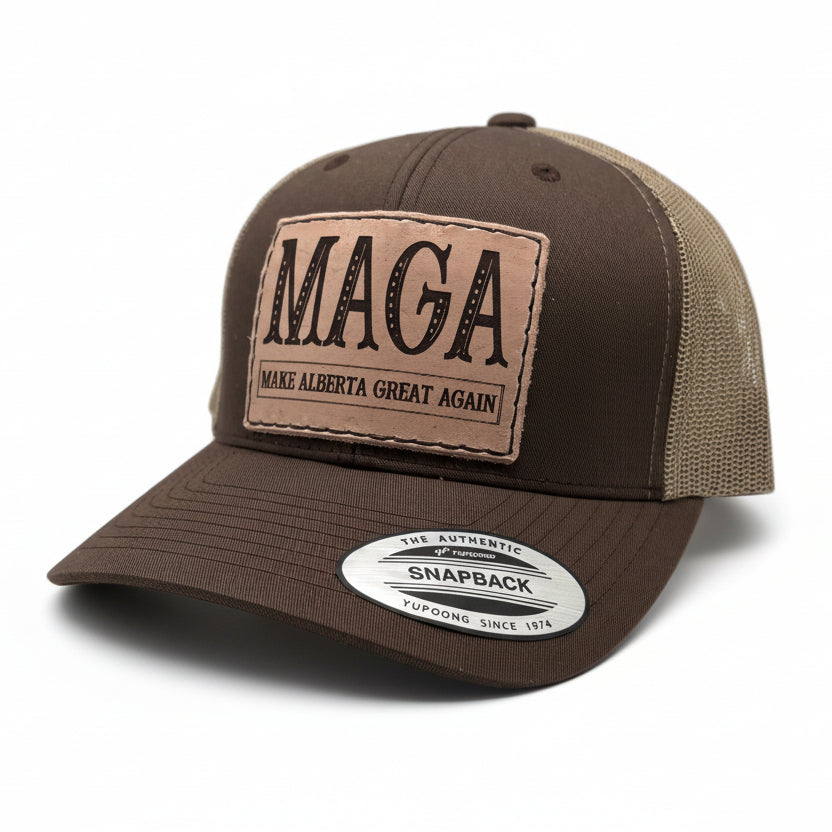 Brown and beige cap with 'MAGA Make Alberta Great Again' patch on a light gray background