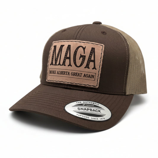 Brown and beige cap with 'MAGA Make Alberta Great Again' patch on a light gray background