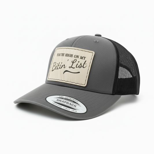 Gray and black trucker cap with a patch on a white background