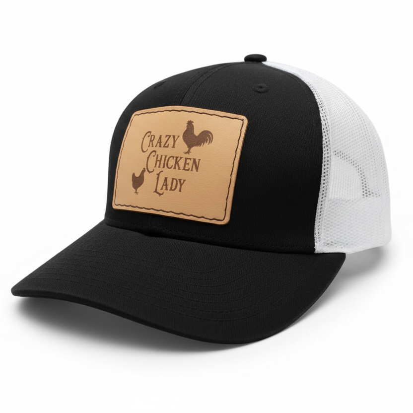 Black and white cap with a brown leather patch featuring text and rooster graphics on a gray background.
