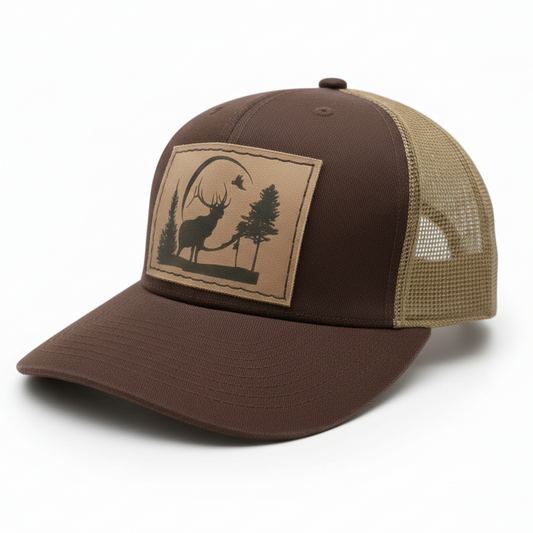 Brown and beige cap with a deer and tree design on a white background