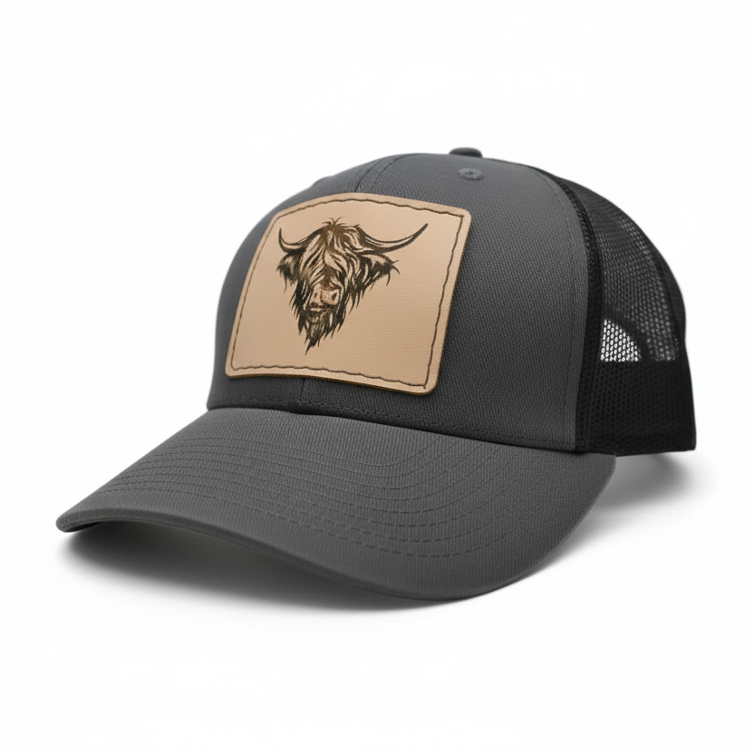 Gray cap with a tan patch featuring a logo on a white background