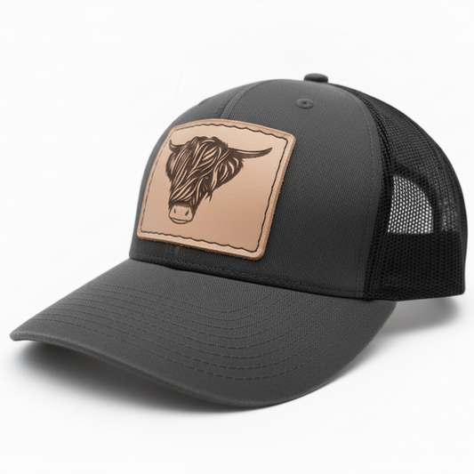 Black cap with brown leather patch featuring a bull's head on a white background