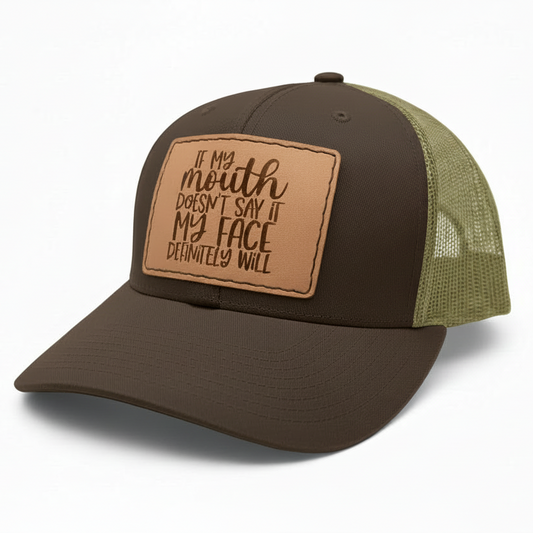Brown and green baseball cap with leather patch on a white background