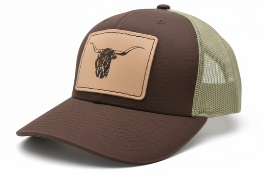 Brown and beige cap with a leather patch featuring a longhorn design on a light gray background.