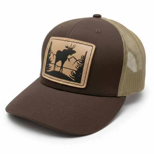 Brown and beige cap with a moose patch on a white background