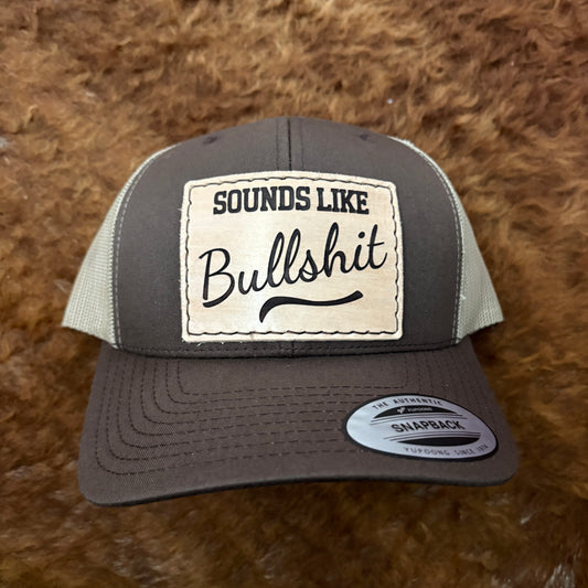 brown hat with a leather hat patch that says sounds like bullshit