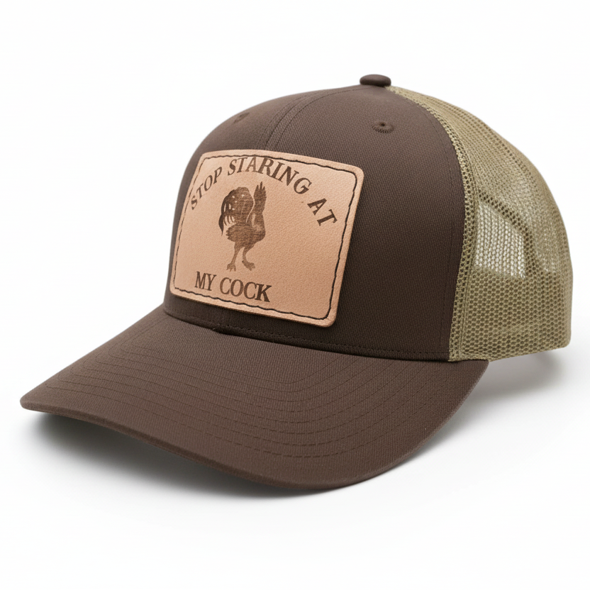 Brown and beige cap with a leather patch on a white background