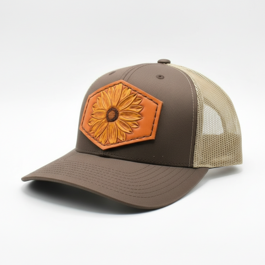 Brown and beige cap with a sunflower patch on a white background