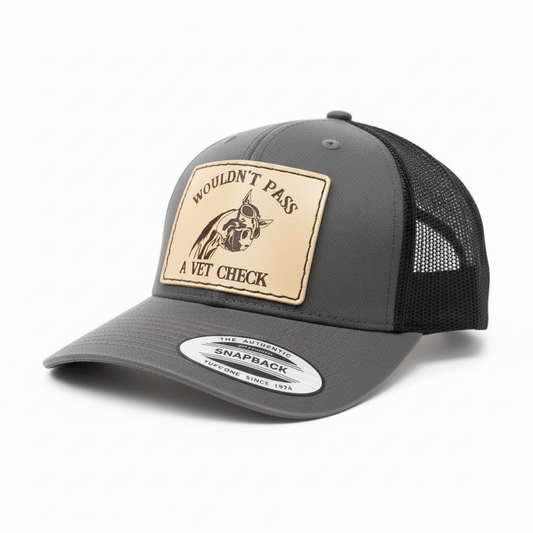 Gray trucker cap with a leather patch and mesh back on a white background